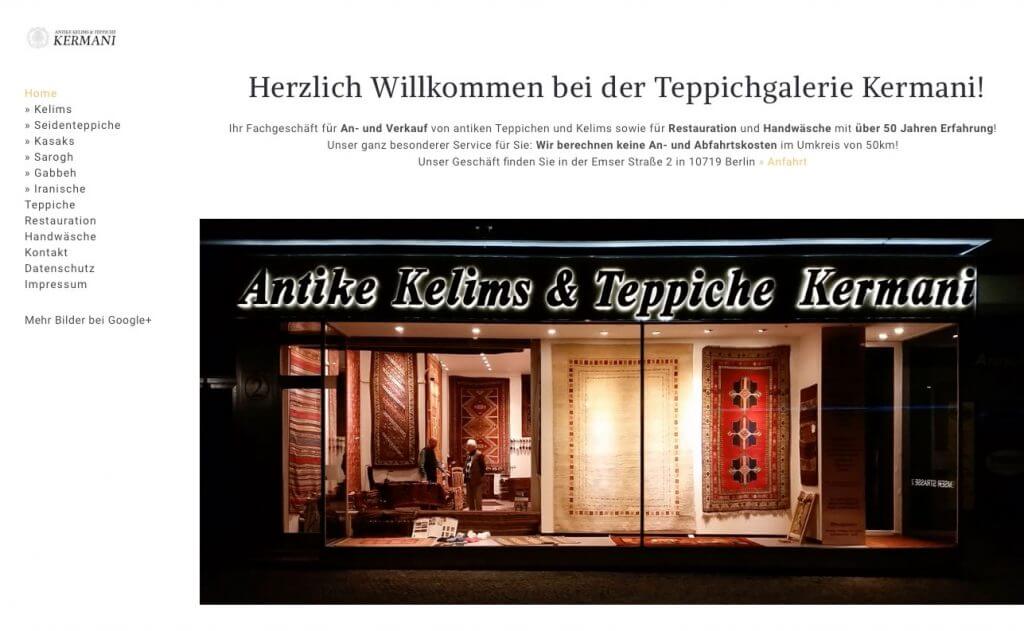 Startseite der Teppichgalerie Kermani mit beleuchtetem Schaufenster